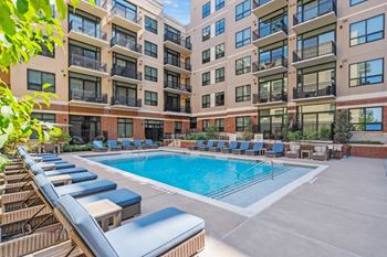 Pool with courtyard and gas grills